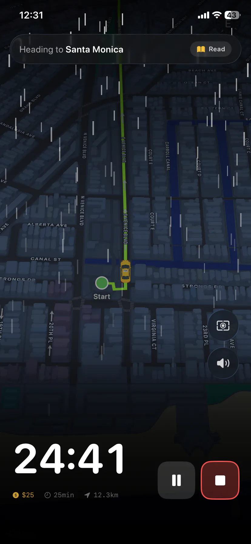 FocusCab shift in progress: a yellow cab driving a rainy night route in Santa Monica with 24:41 left on the meter